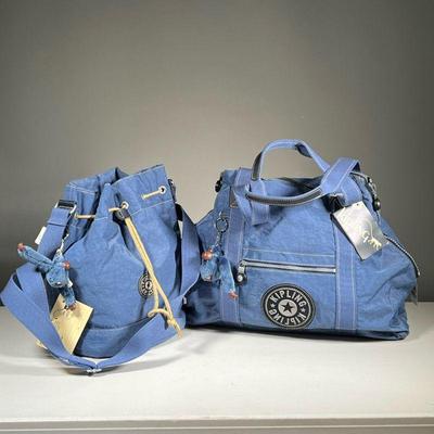 (2PC) BLUE KIPLING SHOULDER BAG & SATCHEL | Features: Kipling denim style drawstring shoulder bag and zipper satchel bag. - l. 23 x...