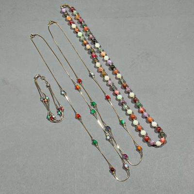 (4PC) BEADED JEWELRY | Gold-tone jewelry, including two similar beaded necklaces and a triple strand beaded bracelet all stamped...
