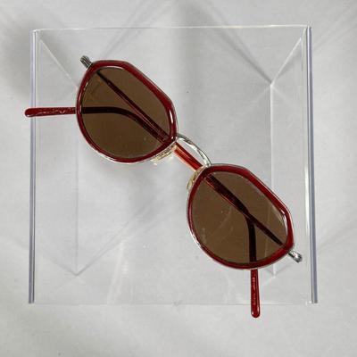 OLIVER PEOPLES SUNGLASSES | Oliver Peoples sleek retro prescription sunglasses with angular red and metallic wire frame. - l. 5 x w. 1.5 in
