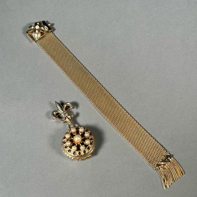 (2PC) GOLD-TONE JEWELRY | Including a fleur de lis locket pendant/pin with four picture frames (h. 2.5 in.) and a tassel woven bracelet...
