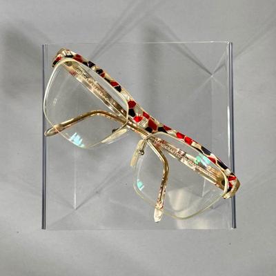 CHRISTIAN ROTH GLASSES | Large Christian Roth prescription glasses from the Optical Affairs series, with a red, black, and white speckled...