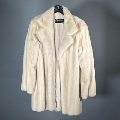 REVILLON FUR COAT | Women's white fur coat with silk lining and Revillon label.
