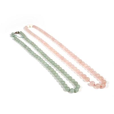 (2PC) CHINESE JADE BEADED NECKLACES | Including a pale green jade beaded necklace with a cloisonne clasp and a pink jade or rose quartz...