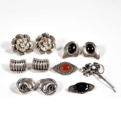 MISC. STERLING JEWELRY | Including an antique German openwork pin with marcasite and faceted black stone, a marcasite and carnelian...
