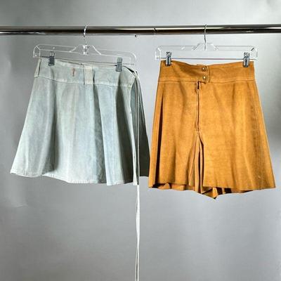 (2PC) LEATHER SKIRT & SHORTS | Including a light blue suede wrap skirt, size small (l. 16.5 in. x overall width 26 in.) and a pair of...