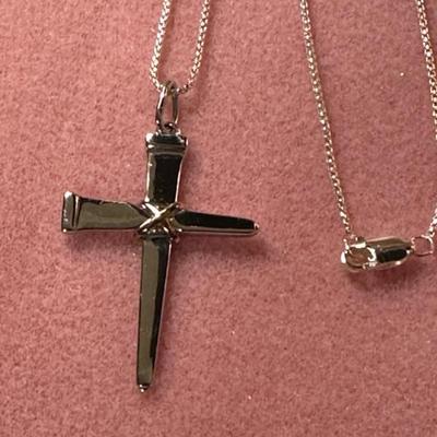 2 Sterling silver nails form this cross. Sterling silver chain is approx 22†long.