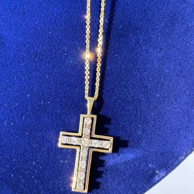 Cross necklace with approximately.75 carats of diamonds. Chain is approx 19 1/2†long and is 14k gold