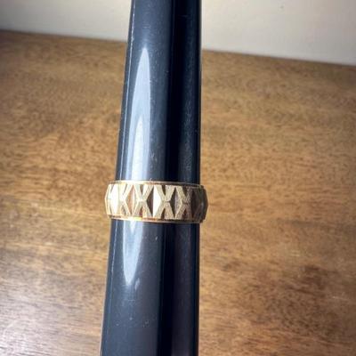 14 k gold men’s ring. Size 9 1/2. Enough detail and texture to be manly, enough shine to get your attention.. use as a wedding band, or...