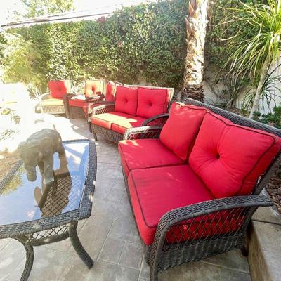 Wicker sofa w/red cushions 