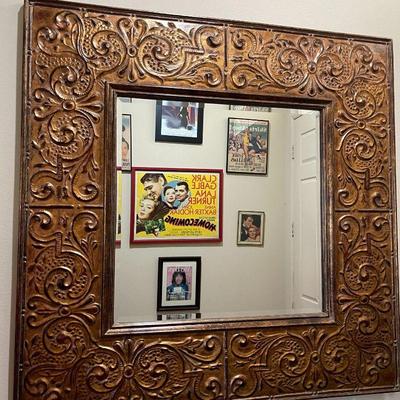 Wide copper tooled framed beveled mirror