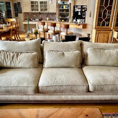 2 matching off-white sofas, 1 of 3 oriental rugs, oversized coffee table