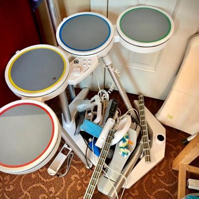 Wii console, game, guitar, and drums