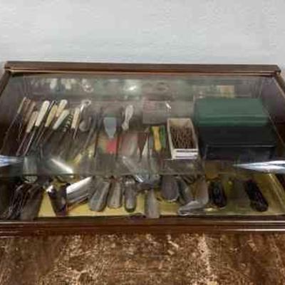 BIHY101 Antique Retail Display Case, Full	This is a wood framed display case with a large collection of branded shoe horns and antique...
