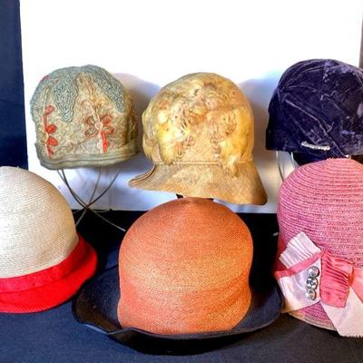 BIHY920 1920-30's Cloche Hat Collection	6 antique and vintage women's hats. Â Stands not included. Â Wear, staining, and torn...