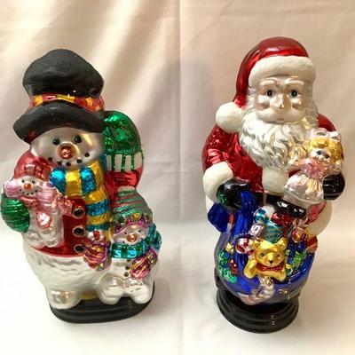 BIHY811 Hand Painted Glass Hristmas Sculptures	Hand painted glass Santa and snowman. Both in original packaging, measuring approximately...