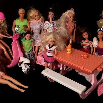 BIHY915 Bin Full Of Vintage Barbie Dolls And Accessories	11"x17" bin full of 17 Barbie dolls, 7 bags of clothes and...