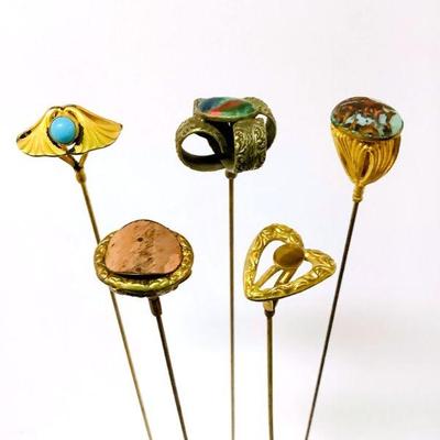 BIHY210 Victorian Art Nouveau Hat Pins	5 different kind of hat pins. A couple of the pins have gemstones. One of the pins has a stamped...
