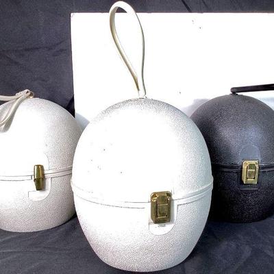 BIHY926 Three Vintage La Ronde Wig/Hat Boxes	Two cool La Ronde by Jet Set egg shape carry totes, hat boxes. 2 white boxes, 1 black box.Â...