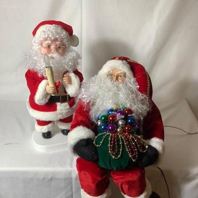 BIHY812 Light Up Santa Statues	Pair of electric Santa decorations. One sits on a ledge and lights up with fiber optic lights, one has a...