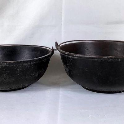 BIHY205 Antique Cast Iron Round Scotch Bowls	Dated back to the 1850's, both have working handles with gate marks #3 & #4. Both do have...