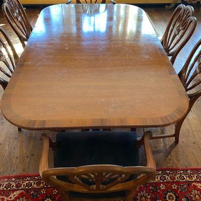 Dining Table, one leaf, approximately 8 ft long with leaf.  Eight chairs.