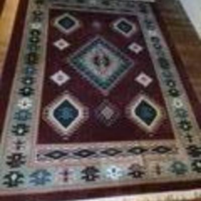 One of a pair of matching room sized wool  rugs