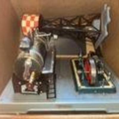 Vintage demonstration steam engine which propels a generator