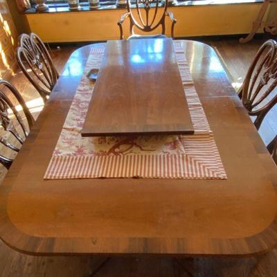 Dining Table, one leaf, approximately 8 ft long with leaf.  Eight chairs.