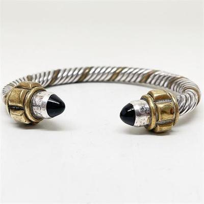 Lot 030   5 Bid(s)
Onyx and Sterling and Brass Torque Cable Bracelet, Signed