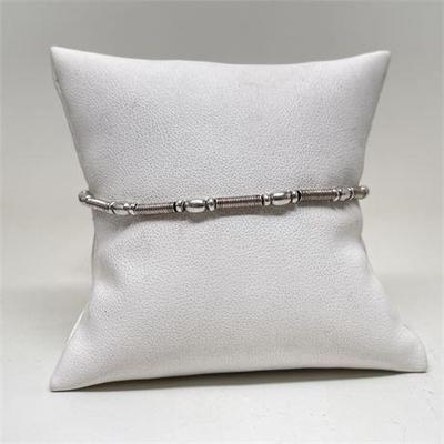 Lot 071   0 Bid(s)
Sterling Silver Bead and Cable Bracelet