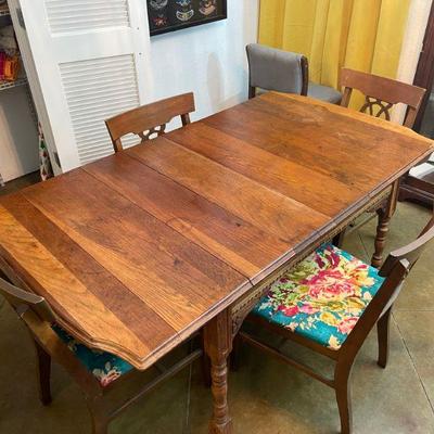 antique dining room table with two hide a leaves. 