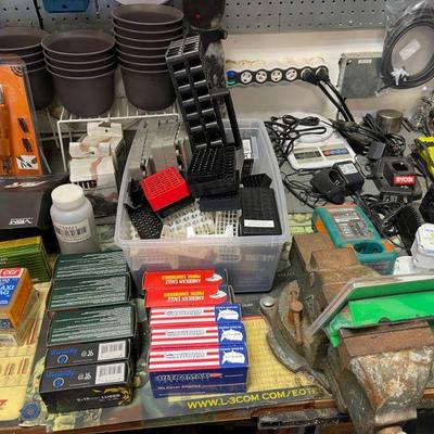 Tables full of reloading equipment and parts 