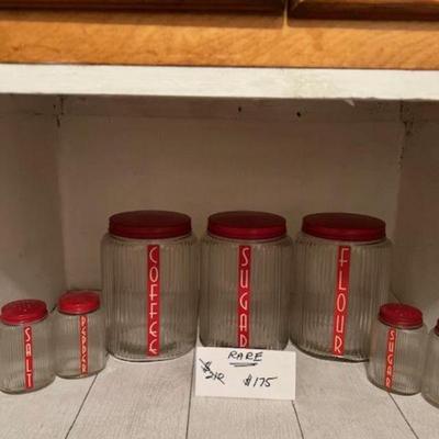 Xtra RARE Hoosier 1930s Deco Canister Set Reduced from $210 to $175
Owens Illinois clear ribbed Ovid shaped 7 piece Red top with red and...