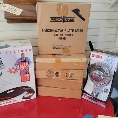 #7022 â€¢ George Foreman Grill, Shower Head and Microwave Plate Mate.
