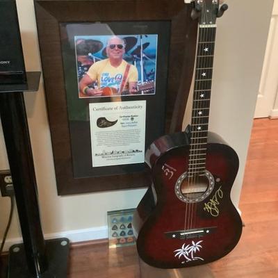 $1300 Jimmy Buffet signed guitar with wooden handmade stand, certificate of authenticity framed 
