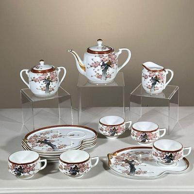 (14PC) KOSHIDA JAPANESE TEA SET | Showing avian and floral scenes with gilt accents. Including; 5 teacups, creamer, lidded sugar bowl,...
