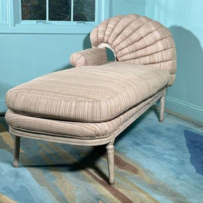 SCROLL UPHOLSTERED CHAISE LOUNGE | Tan lounger with curved scroll work upholstered back. - l. 62 x w. 29 x h. 34 in

