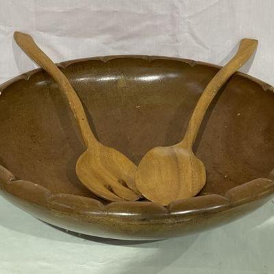 large wooden bowl with utensils
