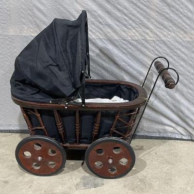 small doll buggy with doll