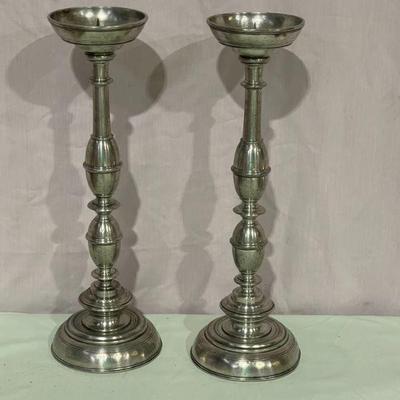 pair of tall candle sticks
