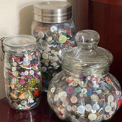 3 containers of buttons