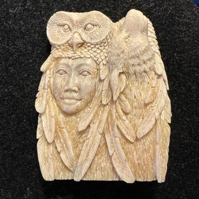 Mammoth hand carved pendant 