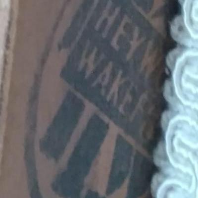 Heywood wake field stamp on end table