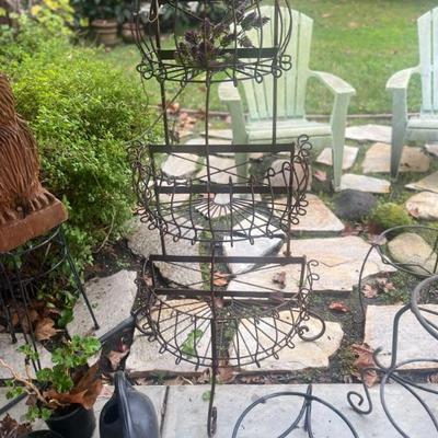 Large wrought iron plant stand sold 