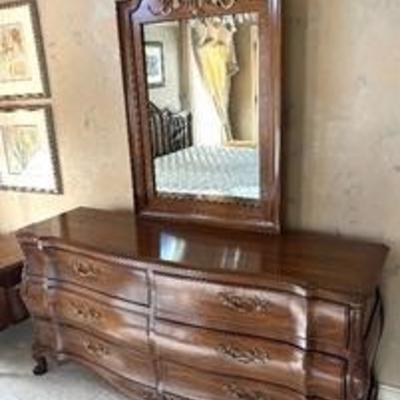 Vintage Dresser with Mirror by White Fine Furniture providing an elegant contour design.

 The dresser measures 69 x 20 x 33 inches.