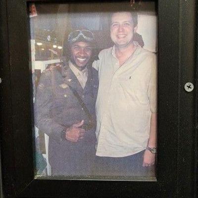 Usher in Photo wearing uniform in previous picture