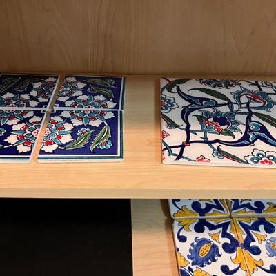Assortment of painted ceramic tiles sold in groups