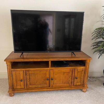 Flatscreen TV and wooden cabinet