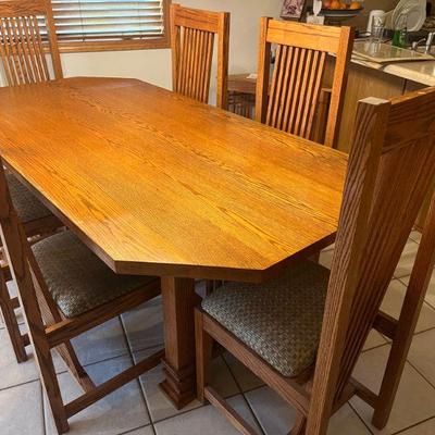 1:Prairie style dining table+ 6 slant back chairs.
