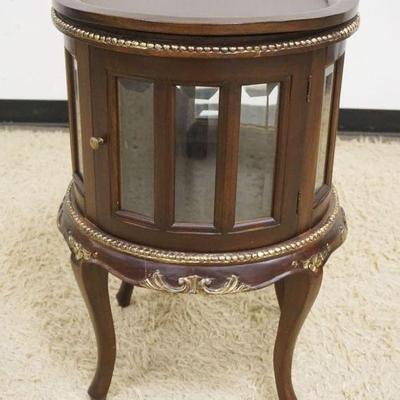 1136	ROUND WALNUT 2 DOOR CURIO STAND WITH BEVELED GLASS PANELS AND REMOVABLE TRAY TOP, APPROXIMATELY 20 IN X 30 IN H
